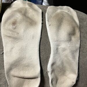 1 pair of women’s well worn socks.